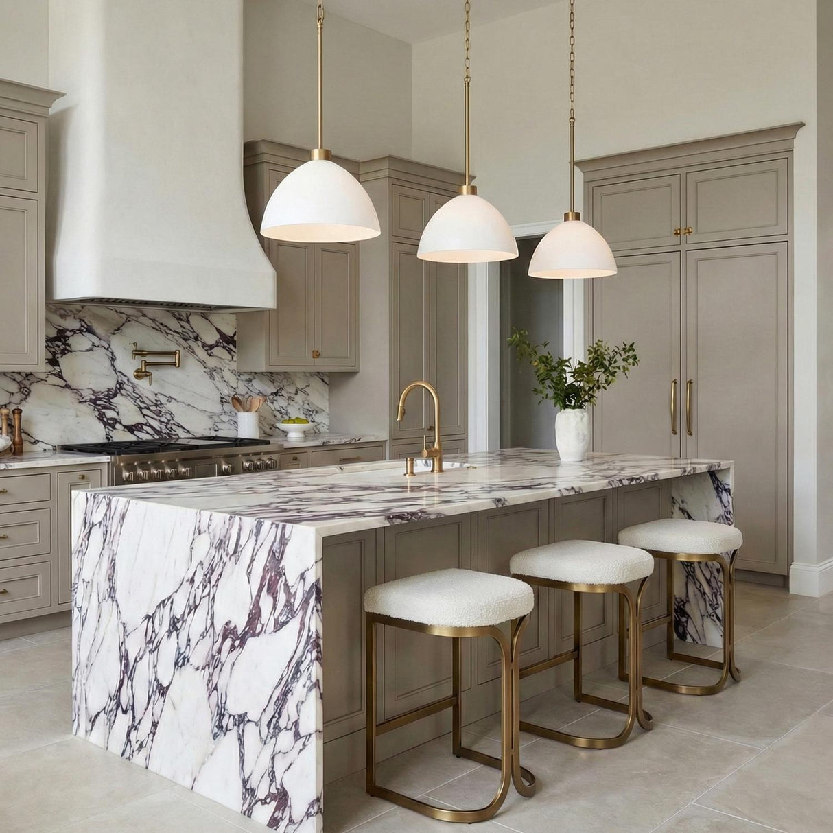 Cleo Pendant White and Aged Brass globe pendant in a Transitional Kitchen with a purple marble island and brass stools.