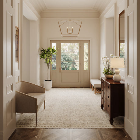Eloise 28" Pendant in brass is shown in a grand, bright foyer with chantilly lace painted walls and traditional furnishings.