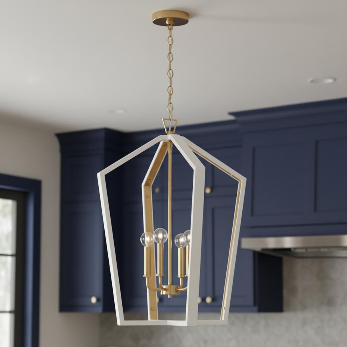 A transitional kitchen features the Talin Lantern Pendant 20 inch, White and Matte Brass suspended along the ceiling against navy blue cabinetry and a patterned grey backsplash.