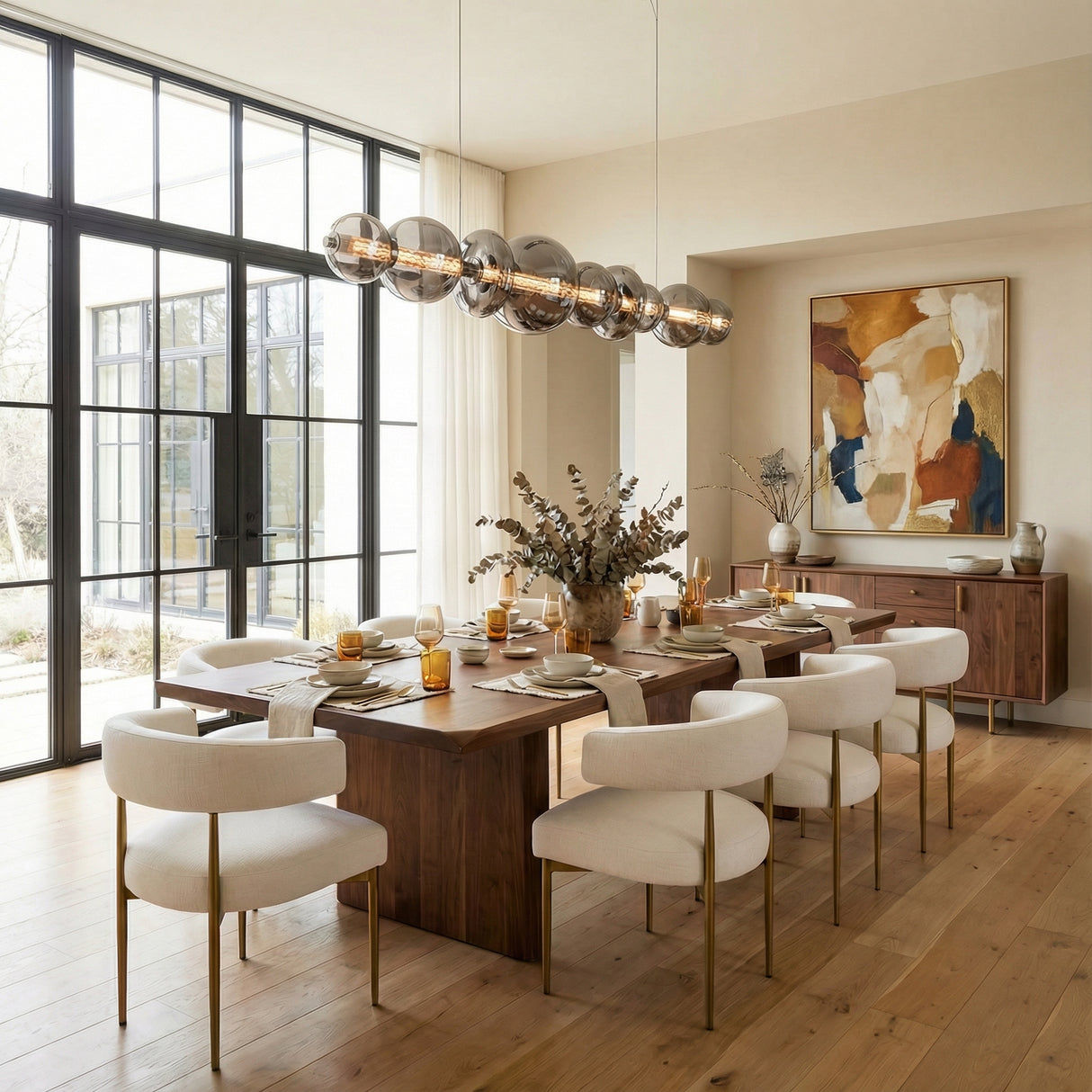 Elara LED 9 Light Linear Chandelier 74", Chrome and Smoke Glass linear chandelier in a Transitional Dining Room with dark wood table.