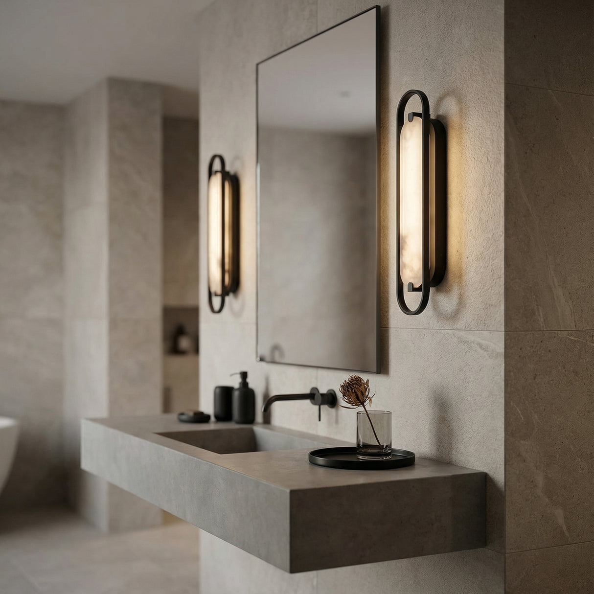 Inez LED Wall Sconce 24", Matte Black and Alabaster linear Wall Sconce in a Modern Bathroom with a floating concrete vanity.
