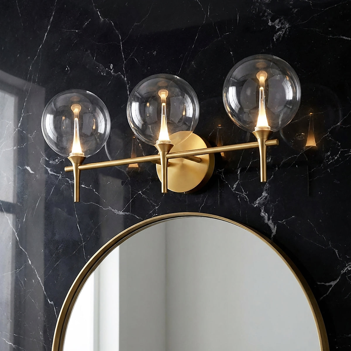Eaton LED 3 Light Vanity, Brass and Clear Glass for Modern home with Black Marble