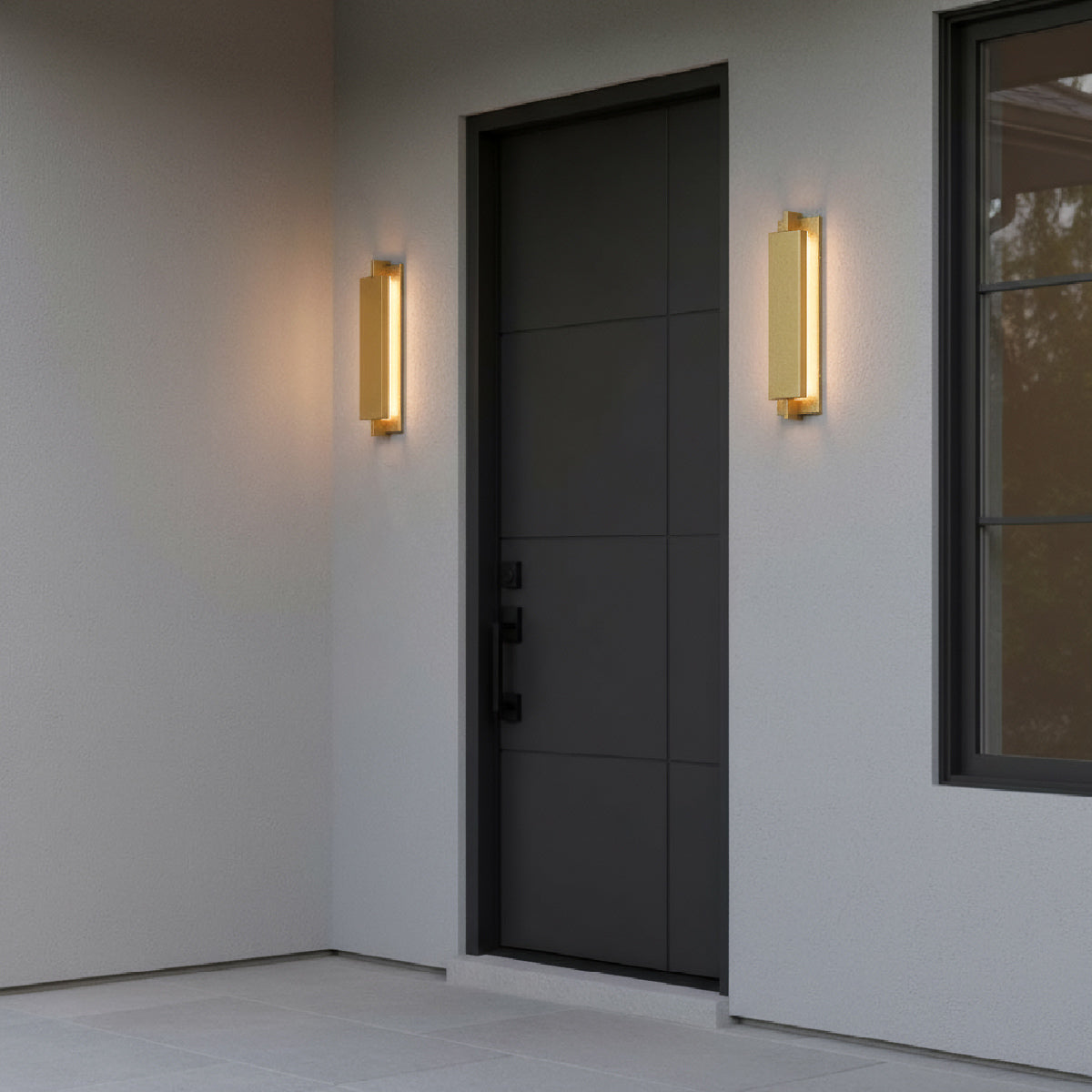Modern black front door with two Rye LED Outdoor 21" Wall Lights, in Textured Gold finish.