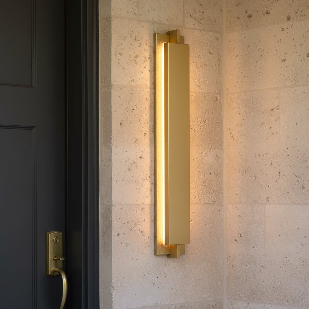 Rye LED Outdoor Wall Light 32",  Textured Gold finish, next to a front door.