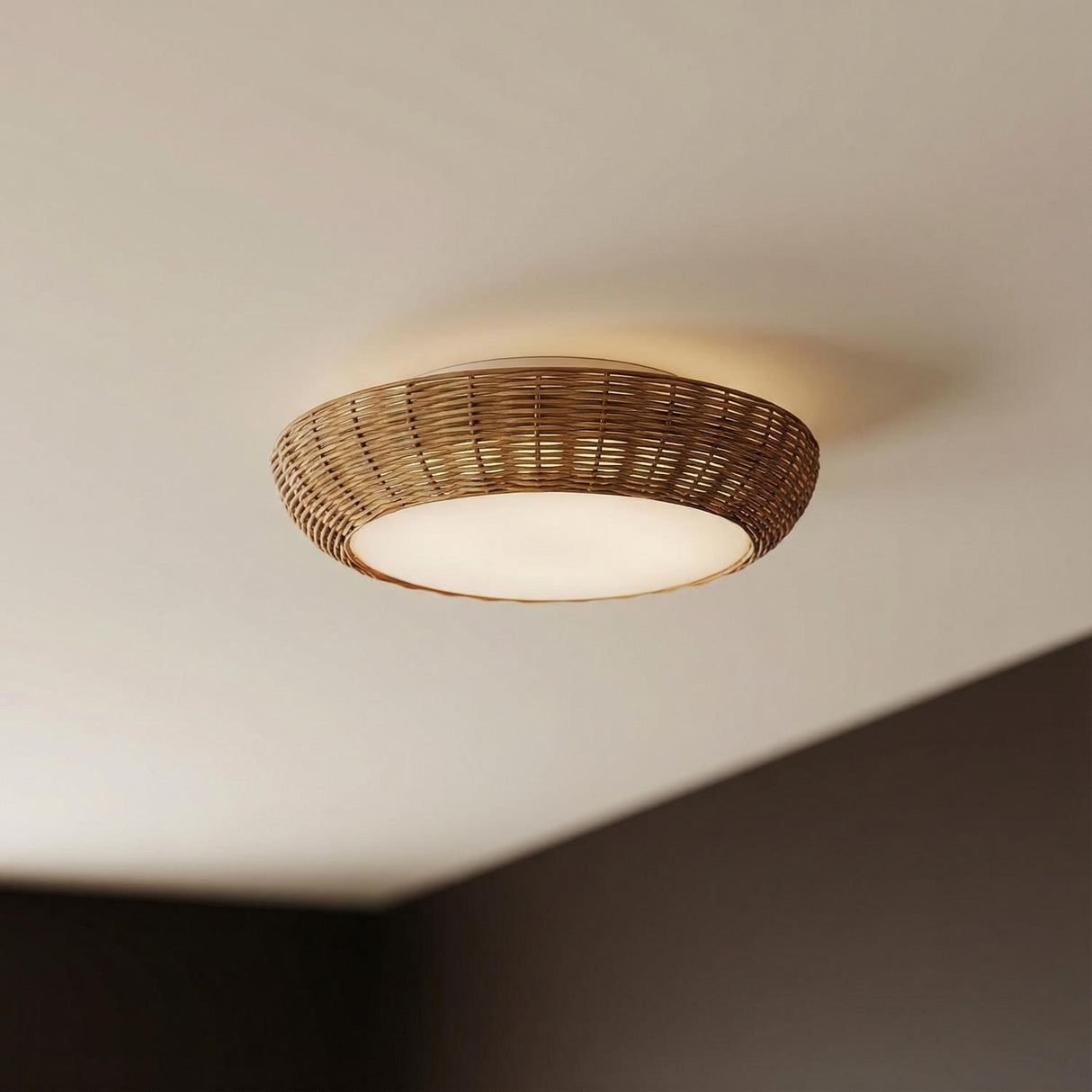 Miramar Flush Mount 15", Rattan and Opal Glass Natural woven flush mount in a Coastal Living Room with a dark accent wall.