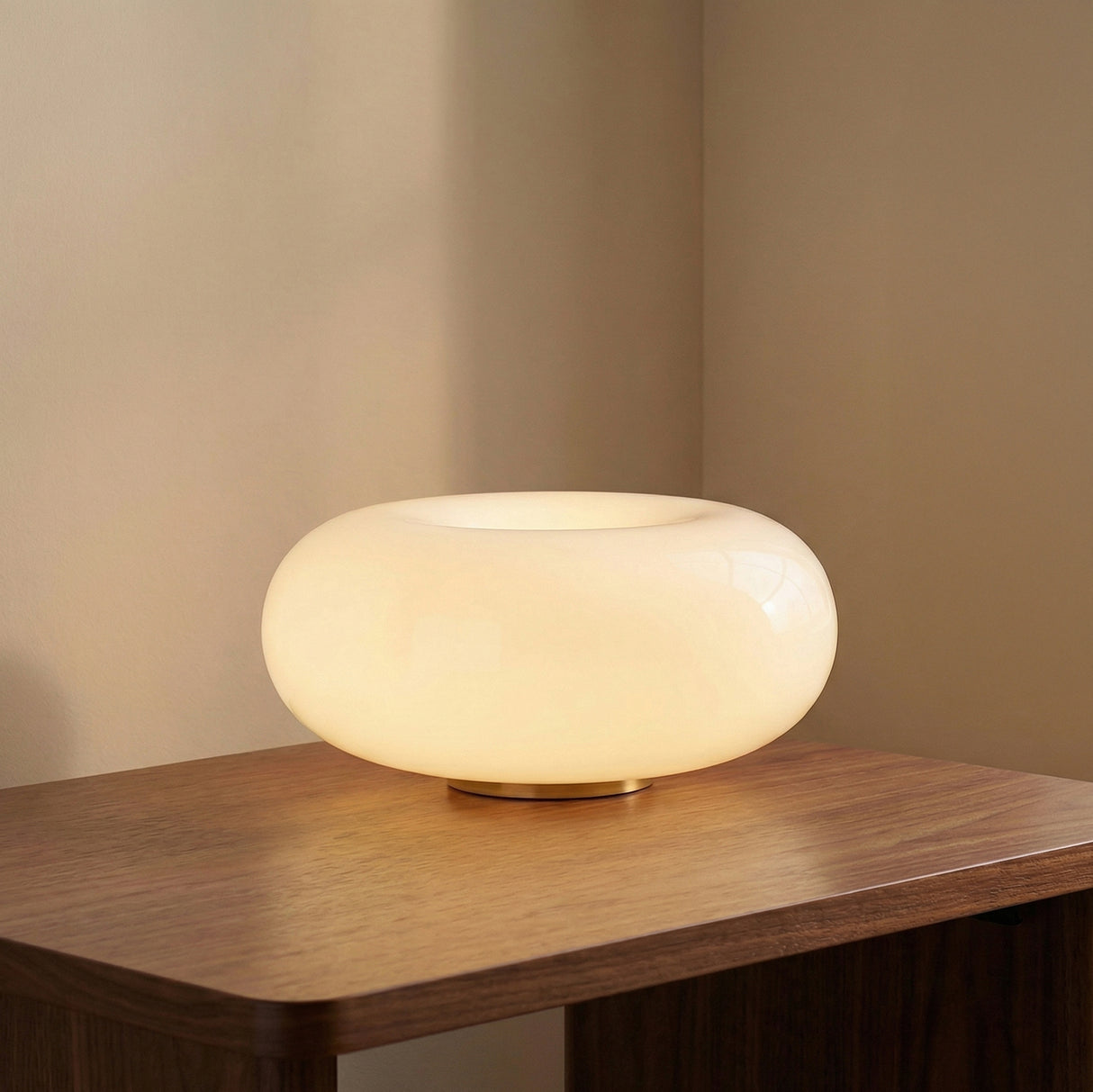 Otto LED Table Lamp 13, Aged Brass and Opal Glass in a Modern Living Room with wood surfaces.