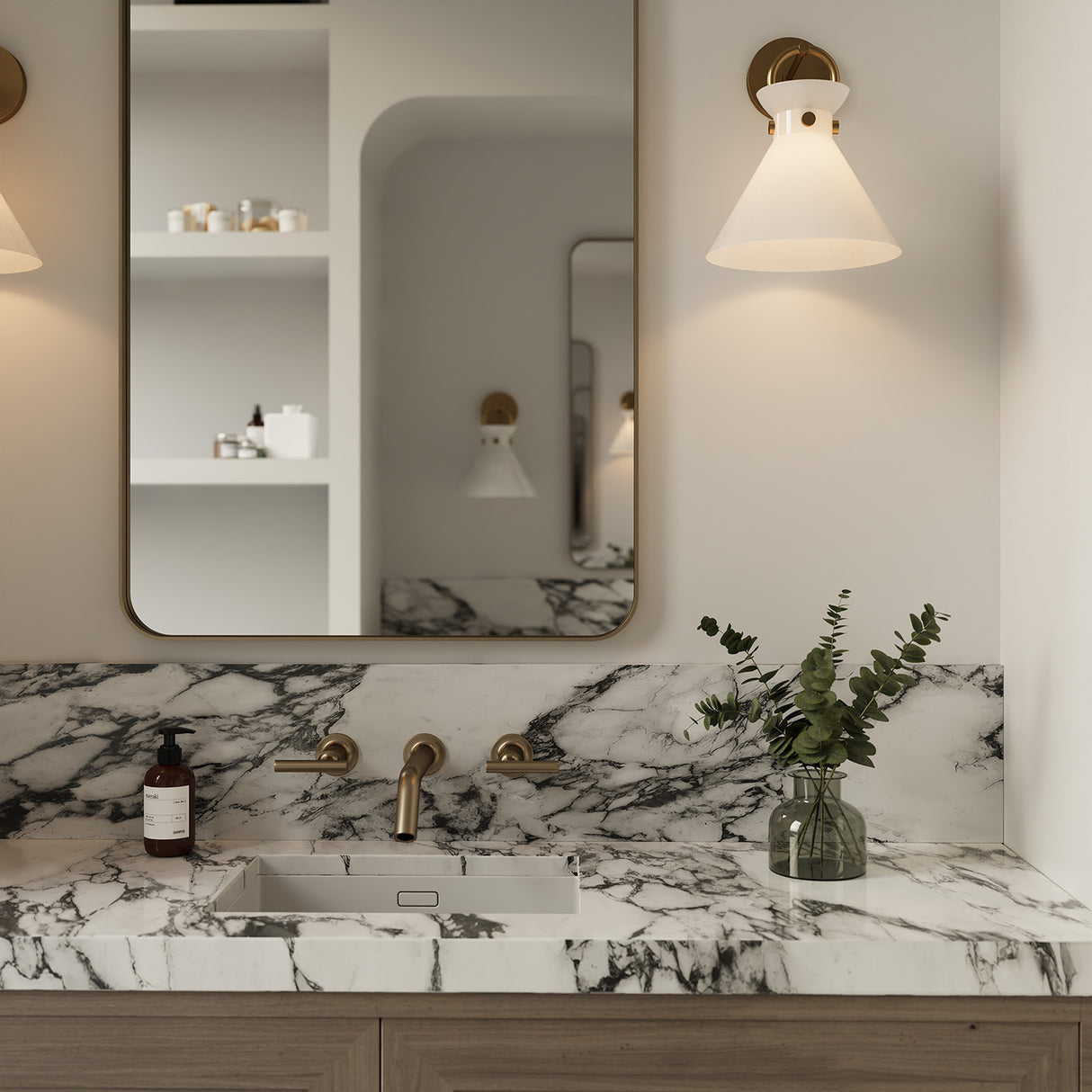 Bathroom vanity with marble countertop, sink, and the Aris Wall Sconce 13", in Aged Brass with a Milk Glass shade