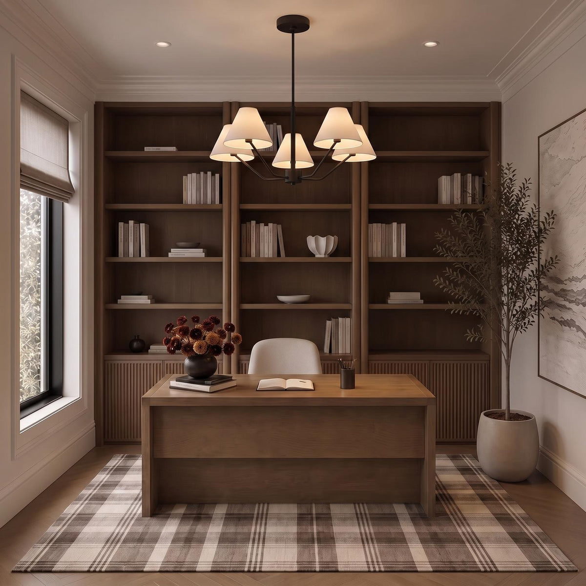 A transitional office featuring the Wallace 5 Light Chandelier 30", Matte Black with white fabric shades suspended above a wooden desk, surrounded by dark wood built-in bookshelves.