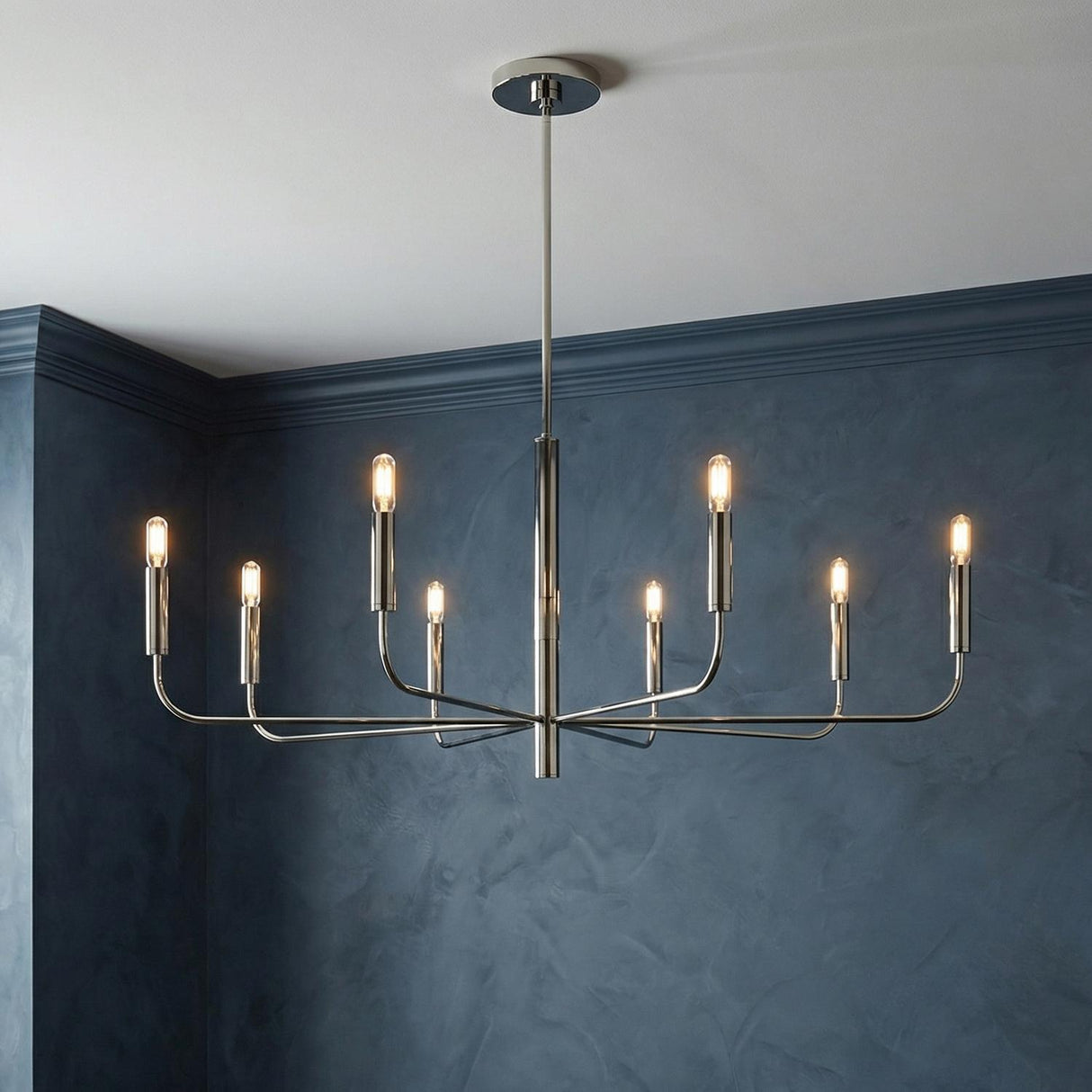 Thayer 8-Light Chandelier, Polished Nickel geometric chandelier in a Contemporary Dining Room with textured blue walls.
