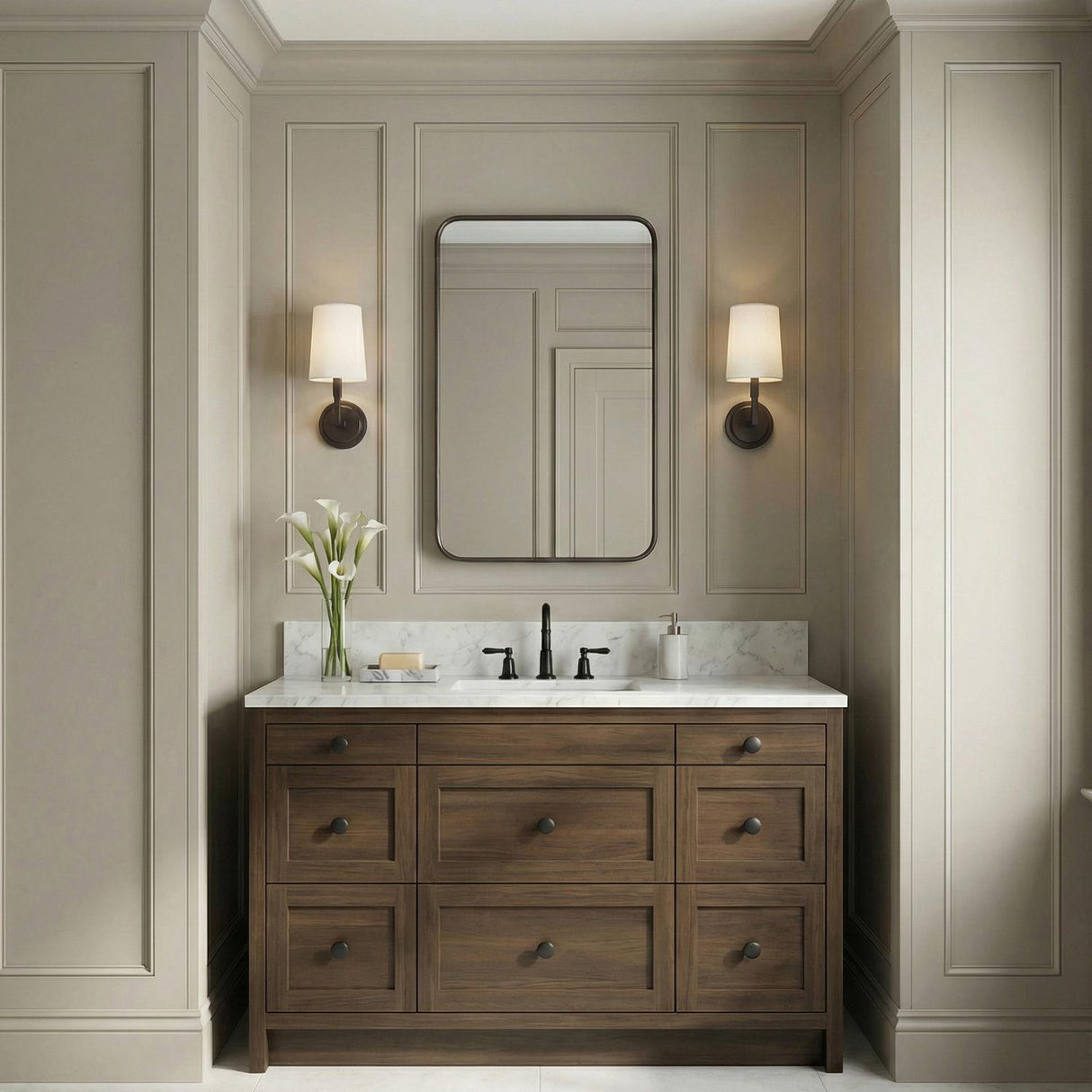 Andrew Wall Sconce 12", Aged Iron geometric Wall Sconce in a Transitional Bathroom with a wood vanity and marble top.