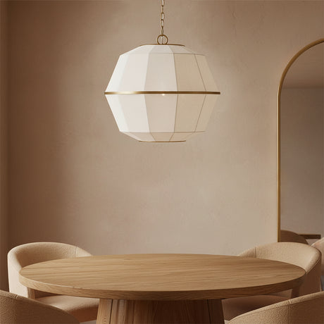 Birch Medium Pendant 22, Modern Brass and White Linen - A white and brass pendant light above a wooden dining table