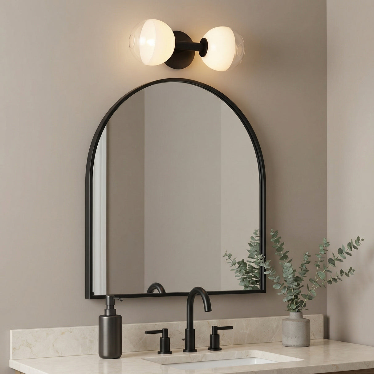 2 Light Matte Black globe vanity light in a Modern Bathroom with a matte black arched mirror and marble vanity.