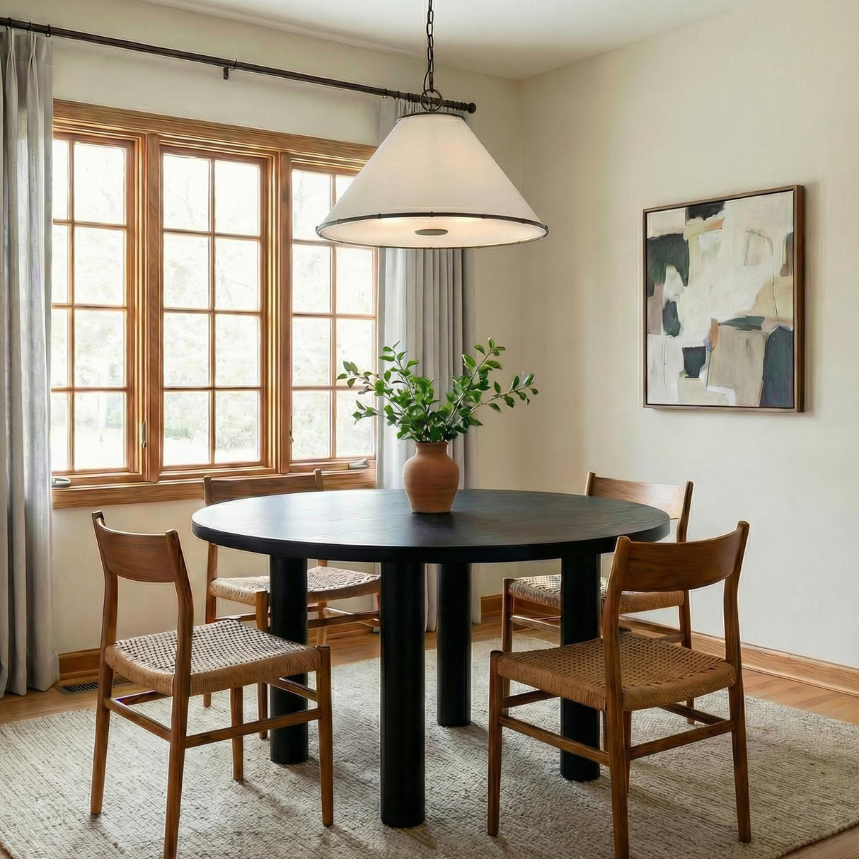 Gael Medium Pendant 22", Aged Iron white geometric pendant in a Transitional Dining Room with a black round table and woven chairs.