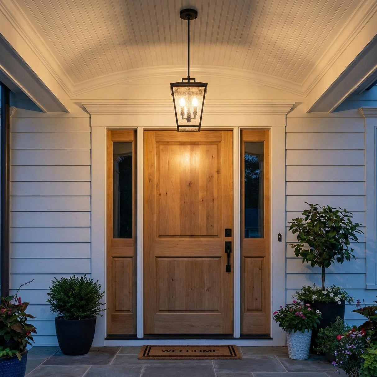 Harrison Outdoor Hanging Light, Textured Black geometric Outdoor Hanging in a Traditional Outdoor with a light wood door.