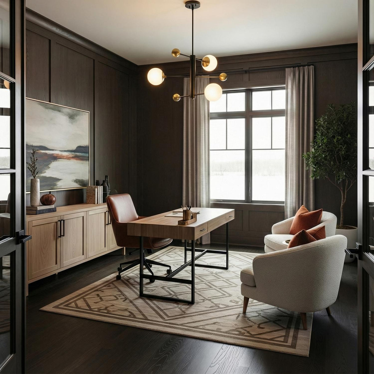 Jubilee Adjustable Chandelier 31", Black and Brass globe Chandelier in a Transitional Office with a modern wooden desk.