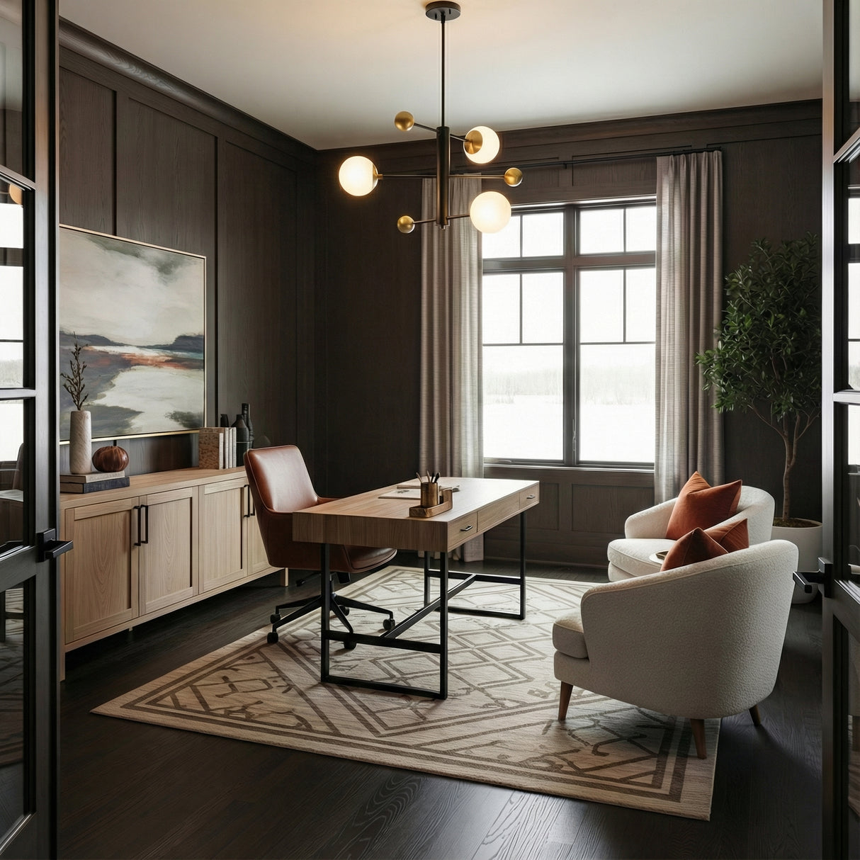 Jubilee Adjustable Chandelier 31", Black and Brass globe Chandelier in a Transitional Office with a modern wooden desk.