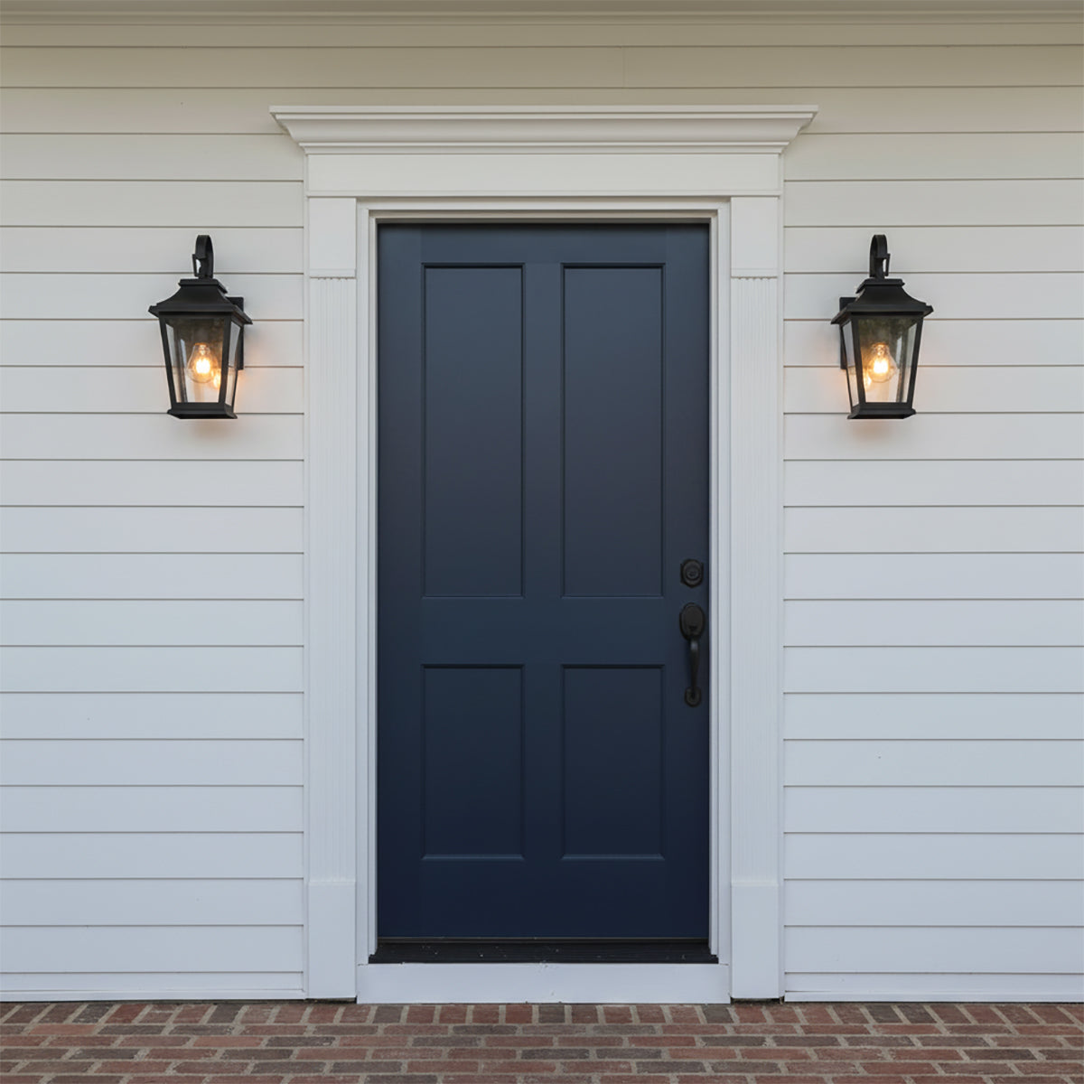 Pembroke Extra Small Outdoor Wall Light 14, Textured Black - Two black lanterns flank a navy blue door