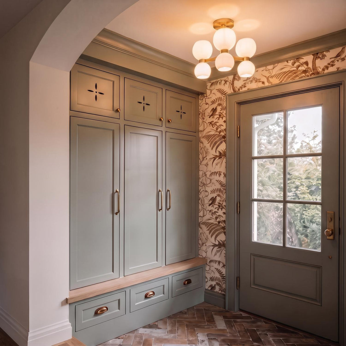 A transitional foyer with the Matilda Semi-Flush 20 inch Modern Brass and Milk Glass fixture on the ceiling above sage green cabinets and herringbone brick floors.