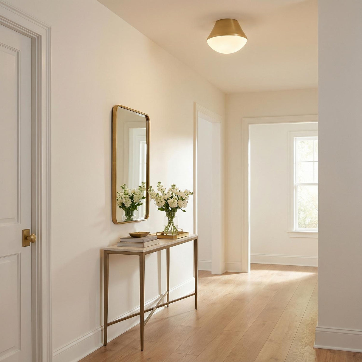 Skylar Flush Mount 11", Satin Brass geometric flush mount in a Transitional Entryway with a gold mirror and marble console table.