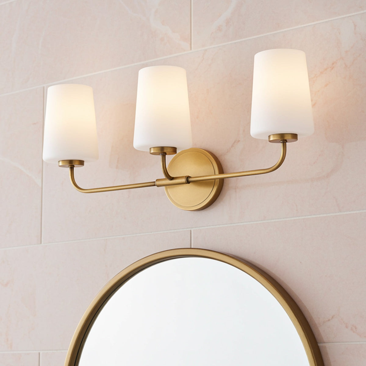 Wyatt 3 Light Vanity, Legacy Brass with Milk Glass for Modern home with Pink Marble Tile