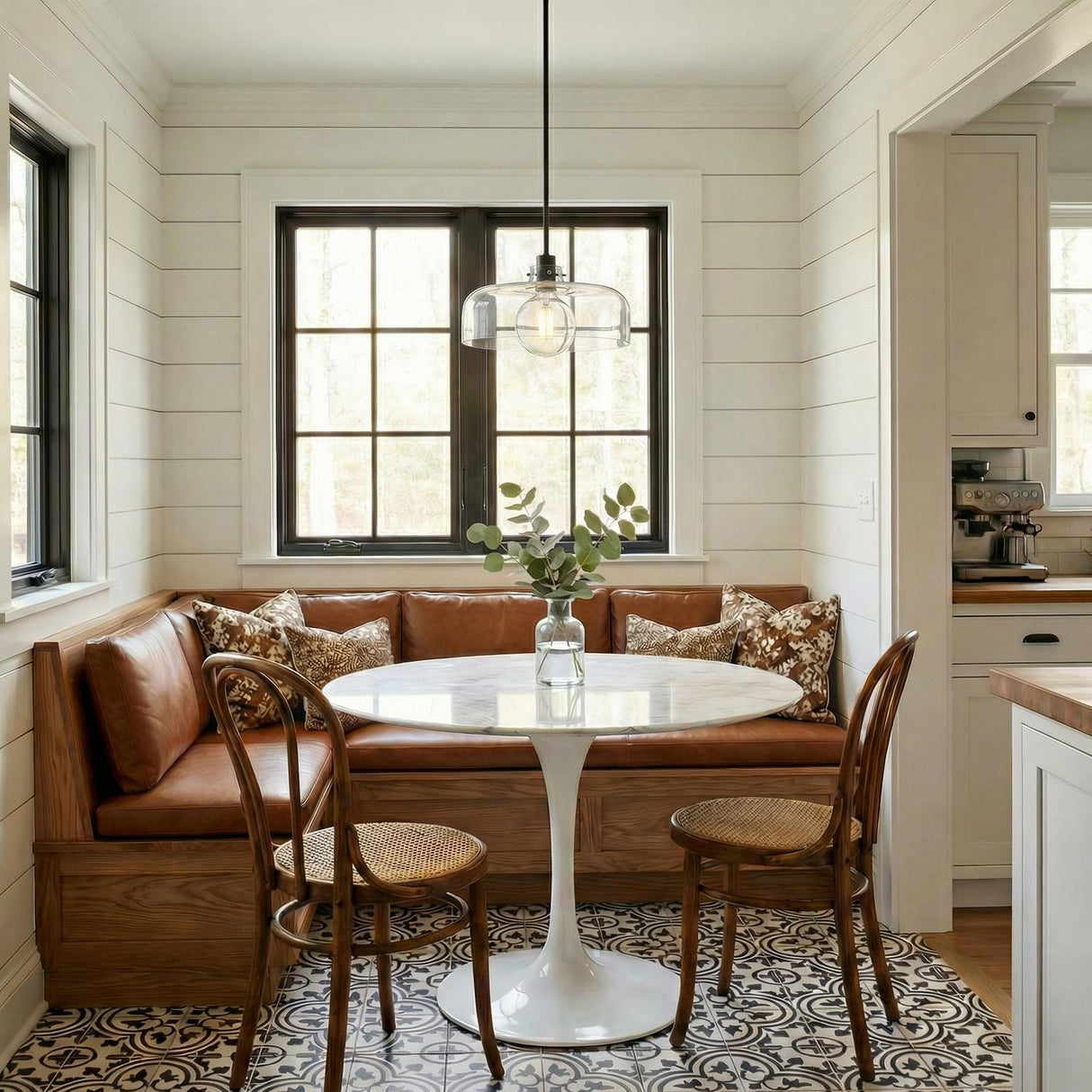 Alder Pendant 15", Black with Clear Glass globe Pendant in a Modern Farmhouse Dining Room with a marble table and leather banquet seating.