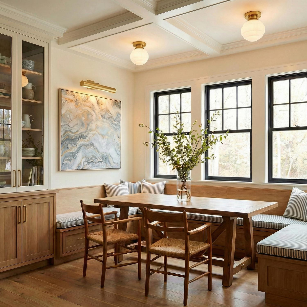 Irving Small Flush Mount 9", Satin Brass globe flush mount in a Transitional Dining Room with a rustic oak table and banquette.
