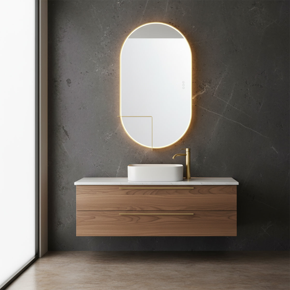 Chadwick Large LED Oval Mirror 24" x 42", Brushed Brass - A modern bathroom with a floating vanity and an illuminated tall oval mirror.