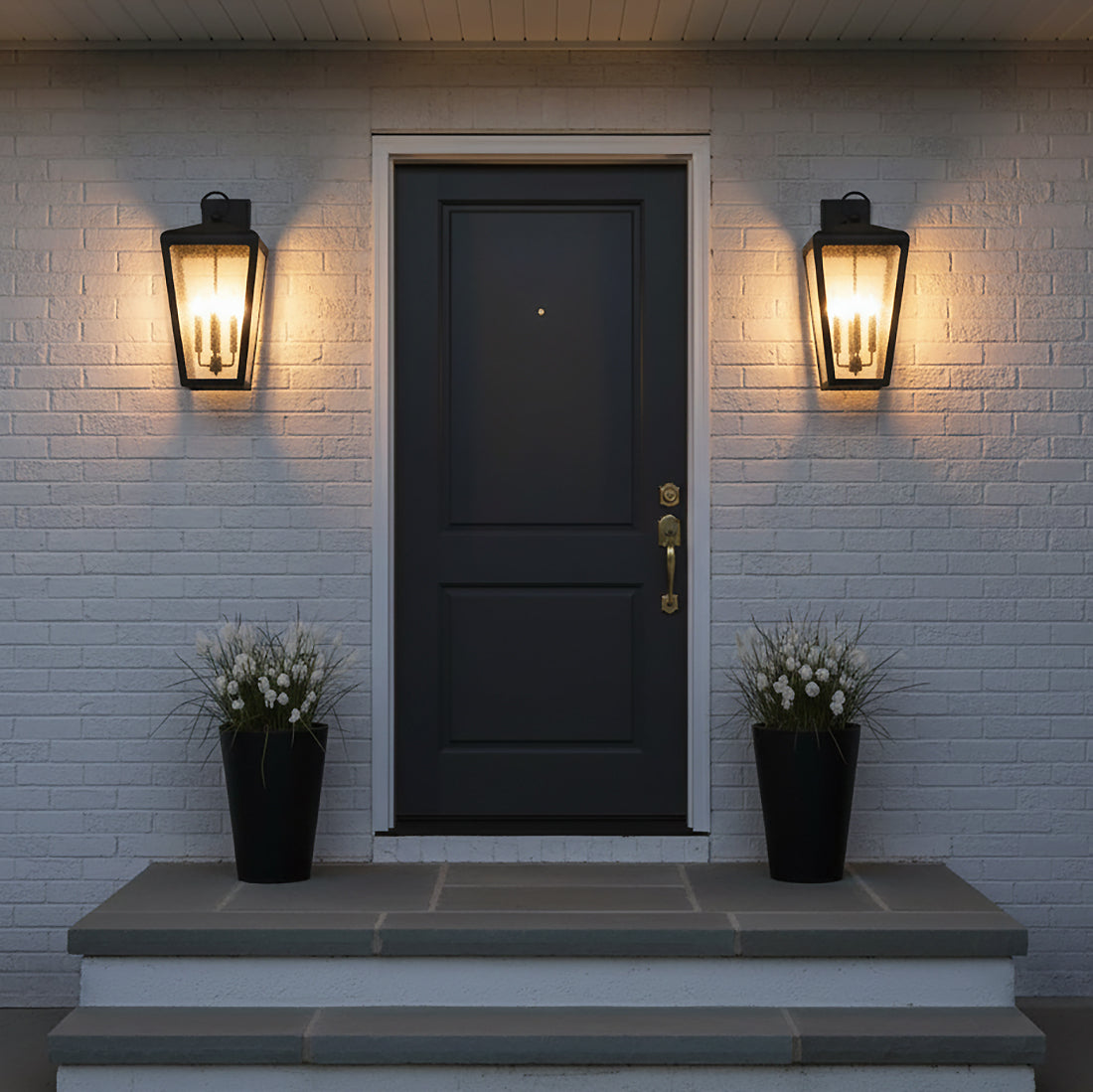 Barrett Outdoor Wall Light, Large 26" Textured Black - Two black lanterns flanking a dark gray door with white brick
