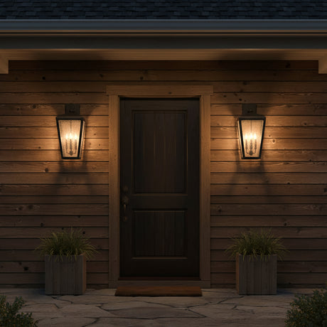 Barrett Outdoor Wall Light, Large 26" Textured Black - Two black lanterns flanking a dark wood door on a wood-paneled house