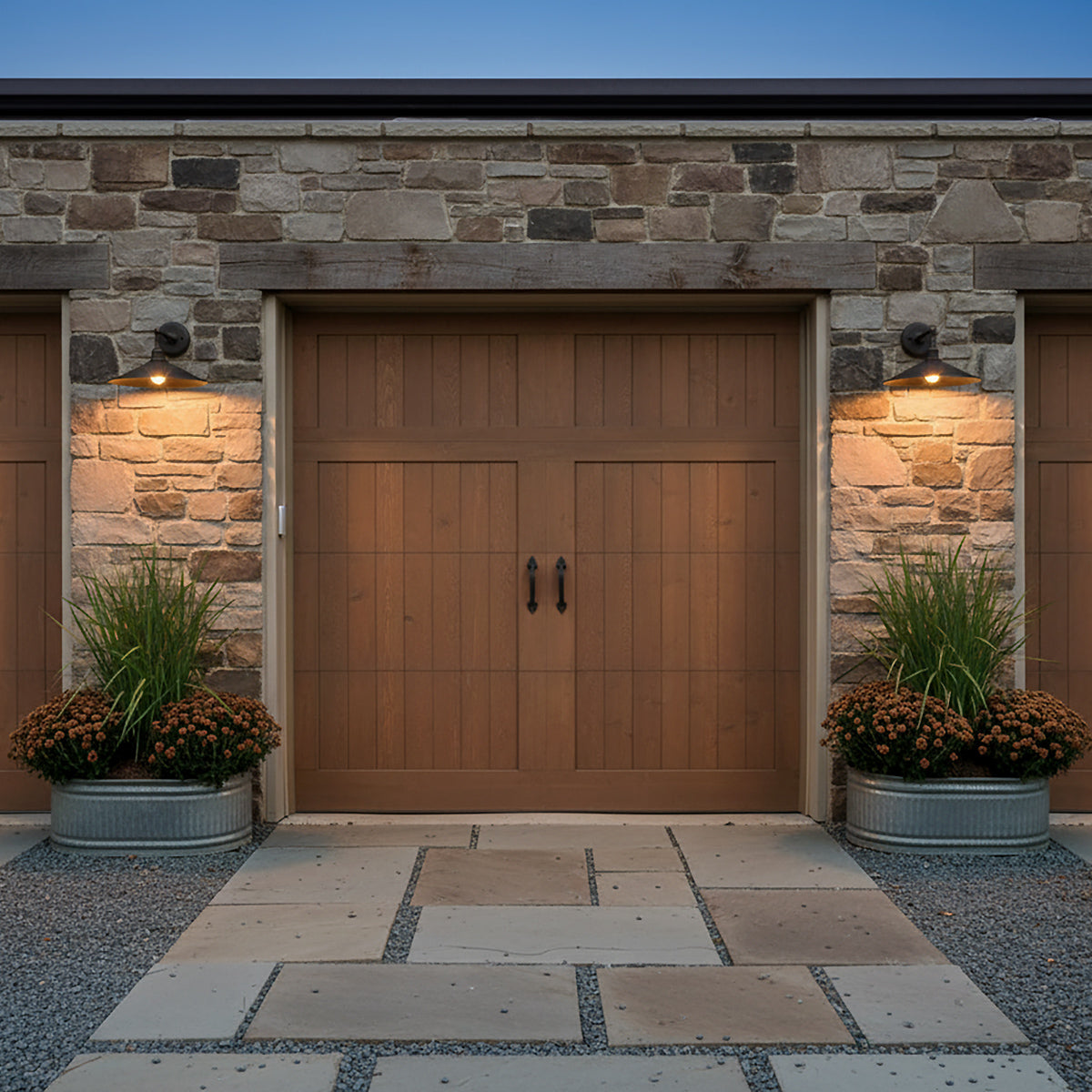 Artie Outdoor Wall Light, Medium Antique Bronze - Two outdoor wall lights flanking a brown wooden garage door