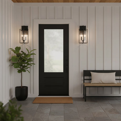 Peyton Outdoor Wall Light, Medium 18" Textured Black - Two black lanterns flanking a black door with a white-paneled exterior wall and a bench.