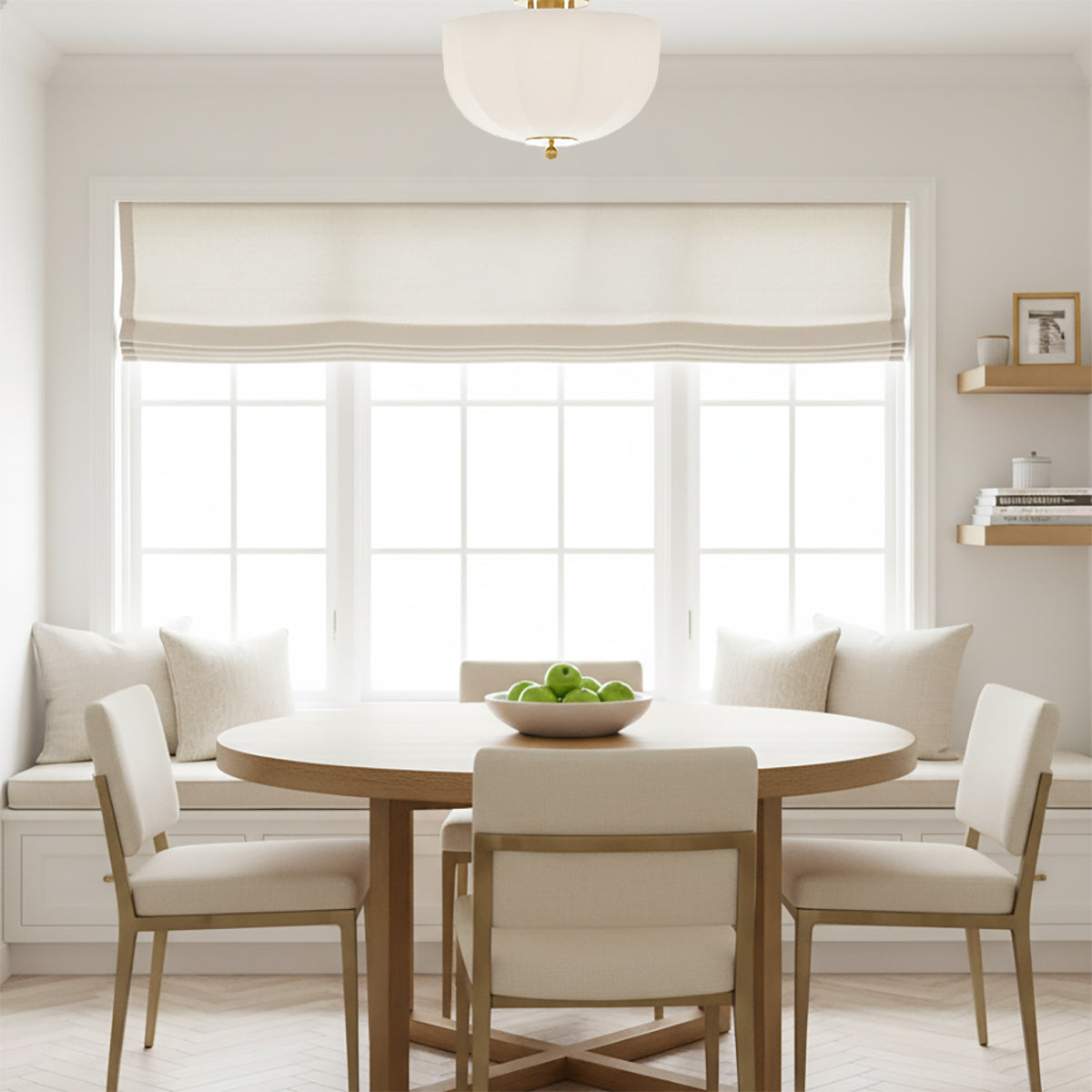 Mayfair Flush Mount 13", Aged Brass - A flush mount light fixture above a dining table in a bright, neutral-toned room.