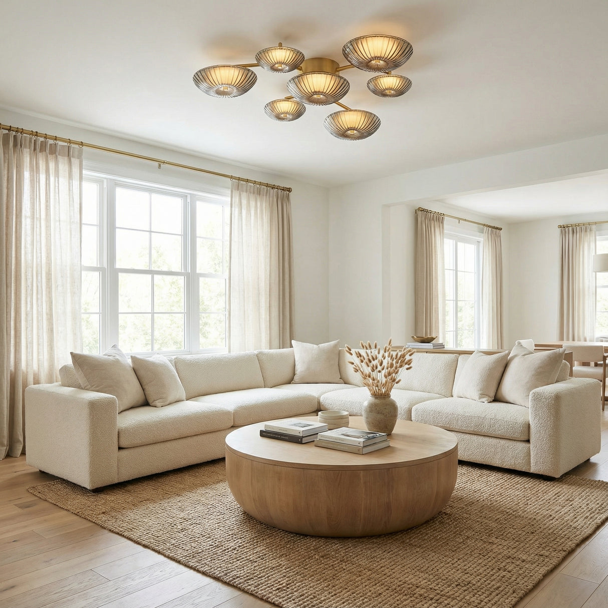 Gaia LED Flush Mount 41", Aged Brass geometric flush mount in a Transitional Living Room with a creamy sectional sofa and round wood coffee table.