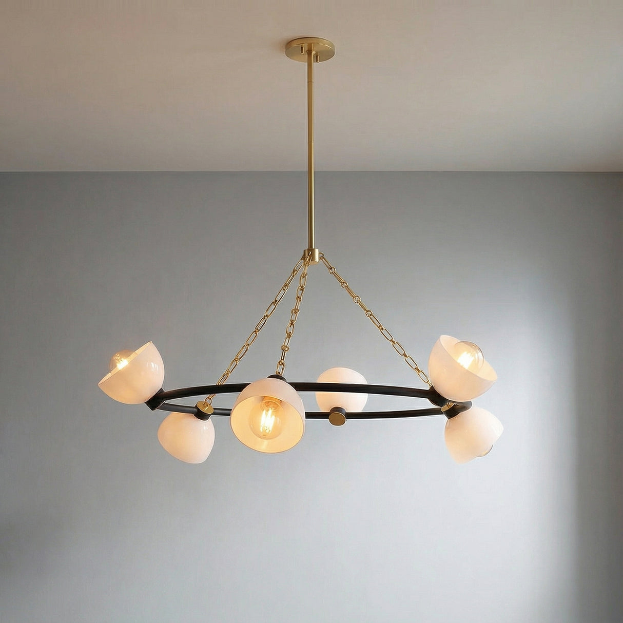 Penrose 6 Light Chandelier 43" styled in a Modern Living Room with grey walls.