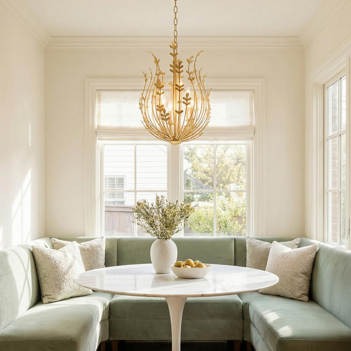 Annelise Chandelier 20", Gold Leaf leaf design Chandelier in a Transitional Dining Room with sage velvet banquet and marble table.