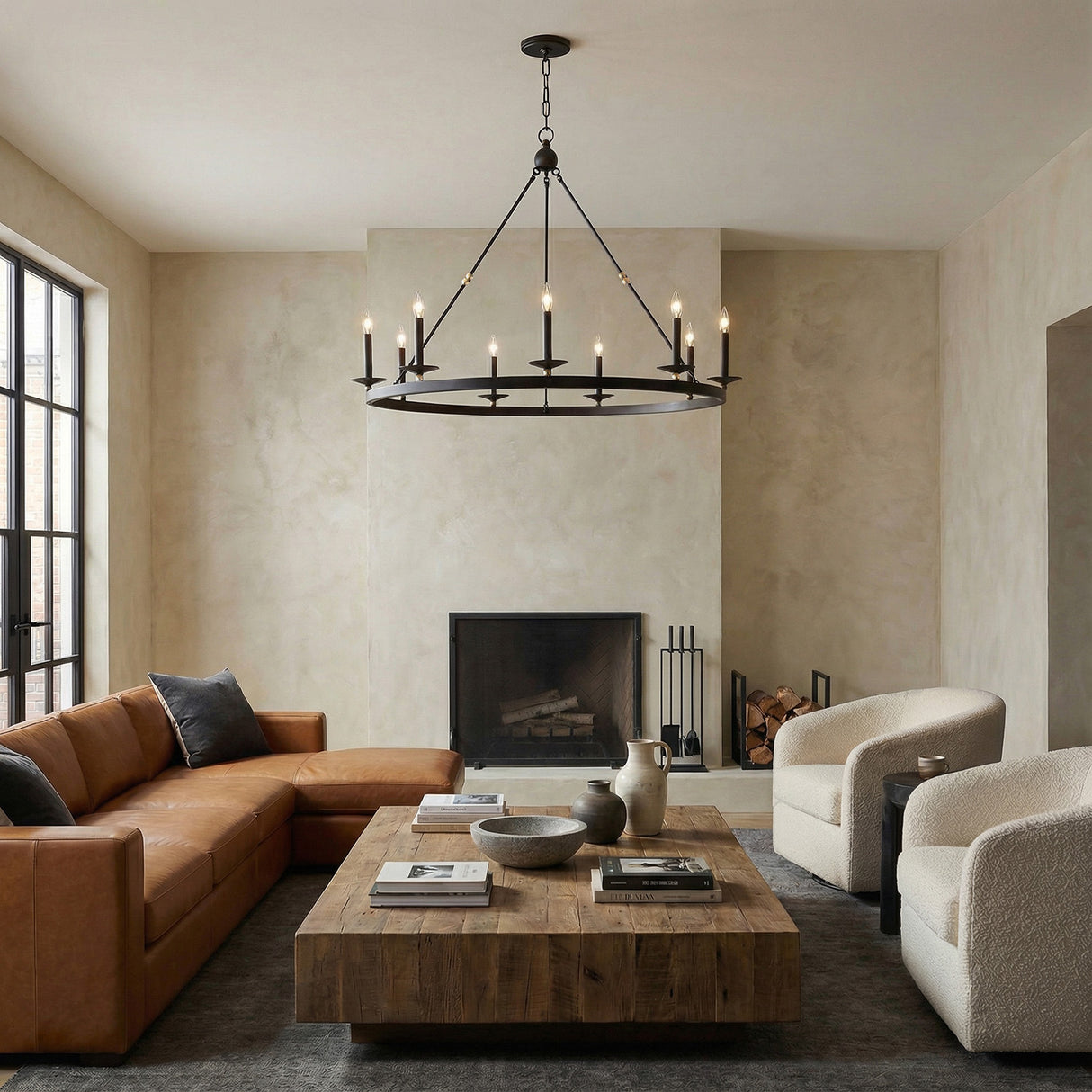 William 9 Light Ring Chandelier 46", Matte Black geometric chandelier in a Transitional Living Room with a brown leather sectional and rustic wood coffee table.