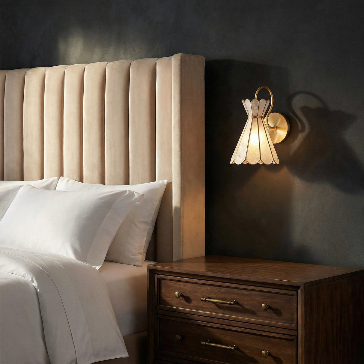 Winifred Wall Sconce 12", Aged Brass scalloped wall sconce in a Transitional Bedroom with a channel-tufted headboard.