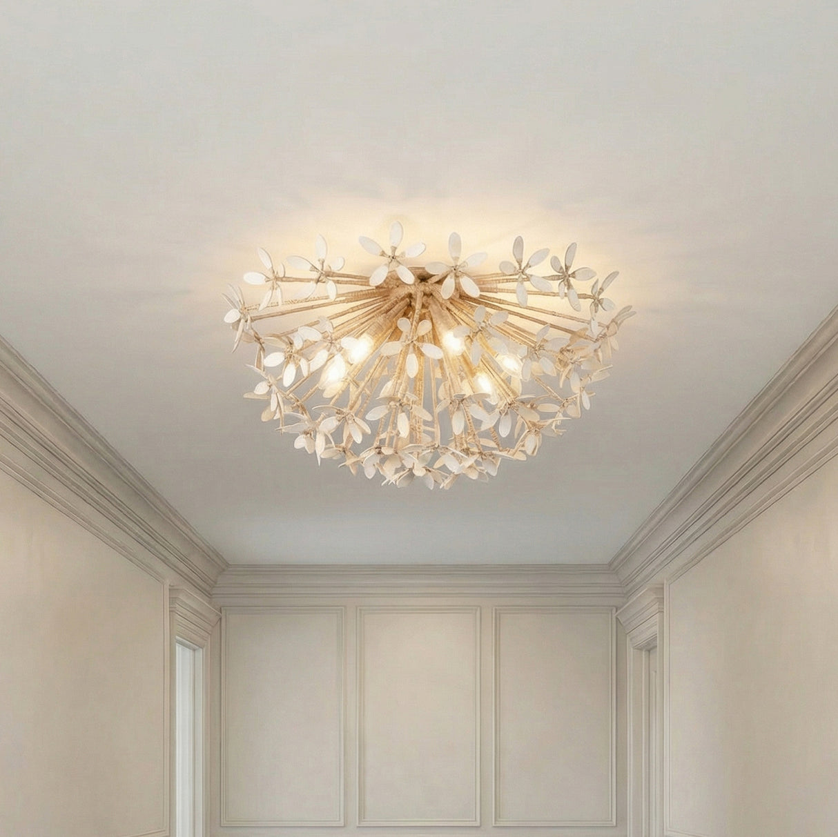 Gold and White leaf design semi-flush in a Traditional Entryway with crown molding and wall paneling.