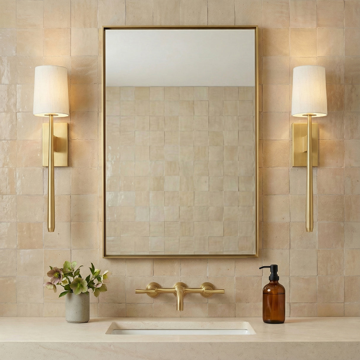 Norene Wall Sconce 25", Aged Brass linear Wall Sconce in a Transitional Bathroom with a beige tiled wall.