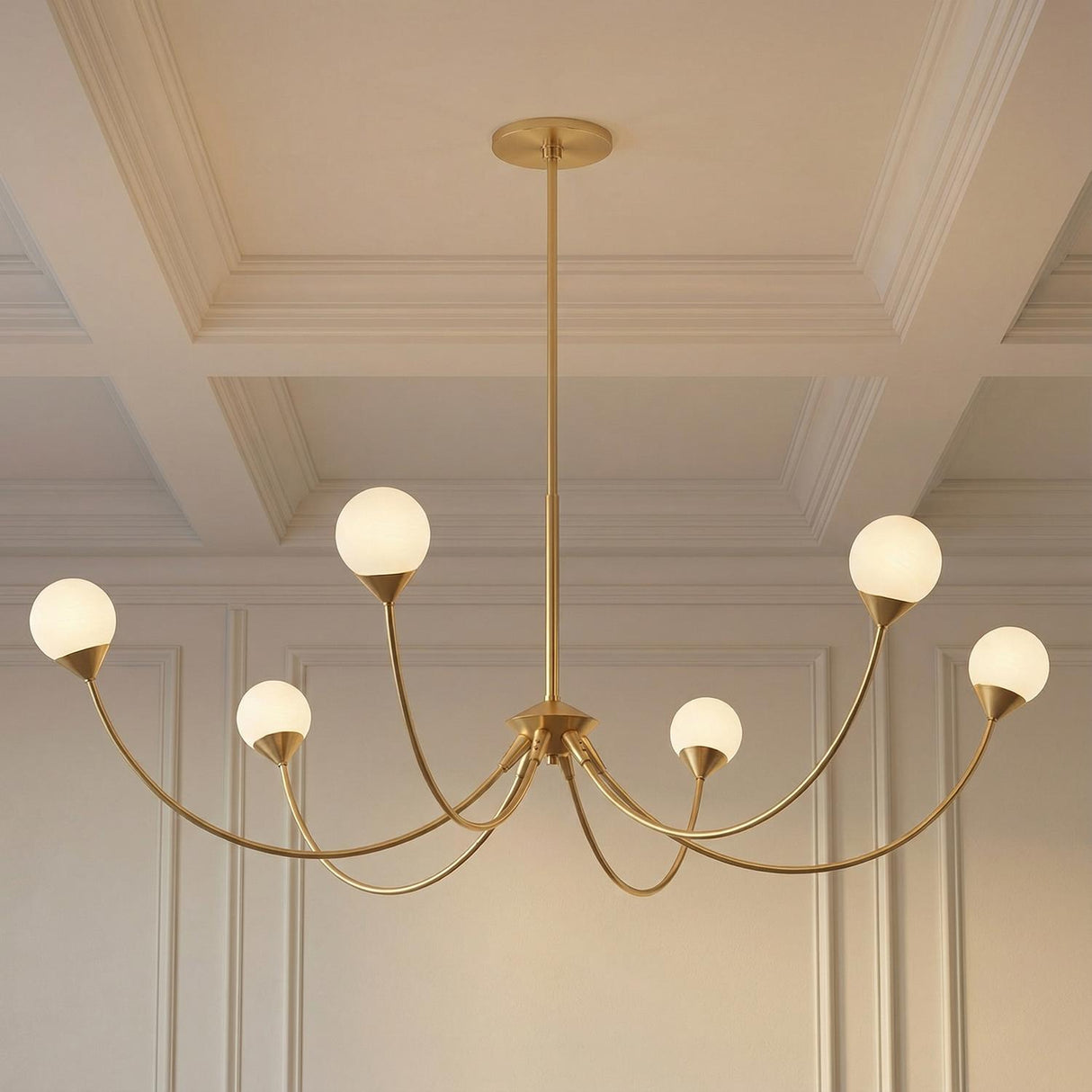 Isabella 6 Light Chandelier, Aged Brass globe chandelier in a Transitional Dining Room with a coffered ceiling and paneled walls.