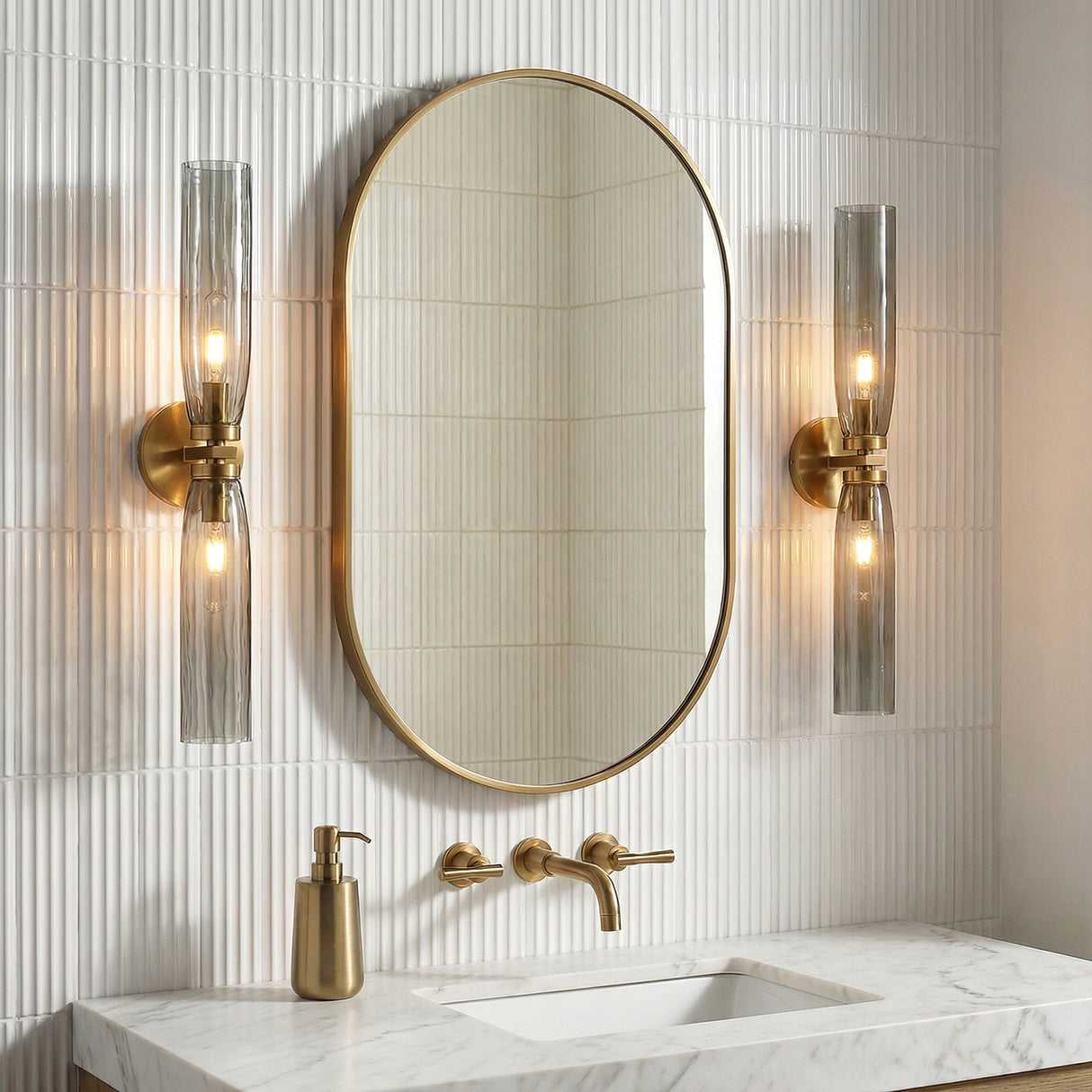 Ernest 2 Light Wall Sconce 24", Aged Brass and Smoke Glass linear Wall Sconce in a Contemporary Bathroom with a marble vanity.