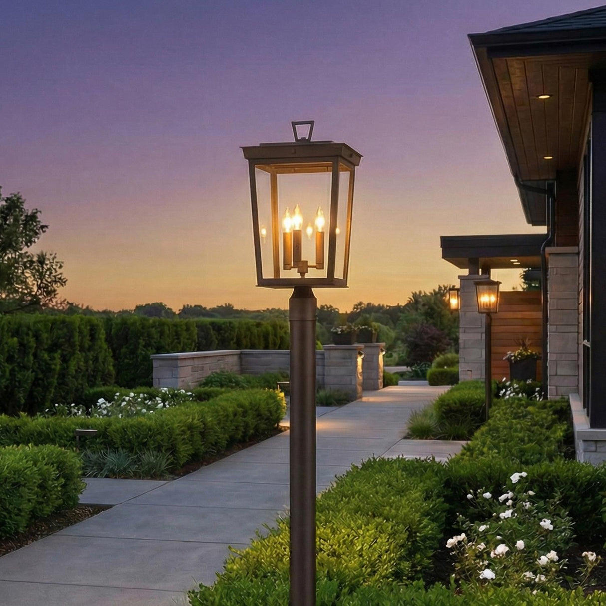 Radcliffe Outdoor Post Light, Old Bronze geometric Outdoor Post in a Contemporary Outdoor with manicured hedges and stone walkway.