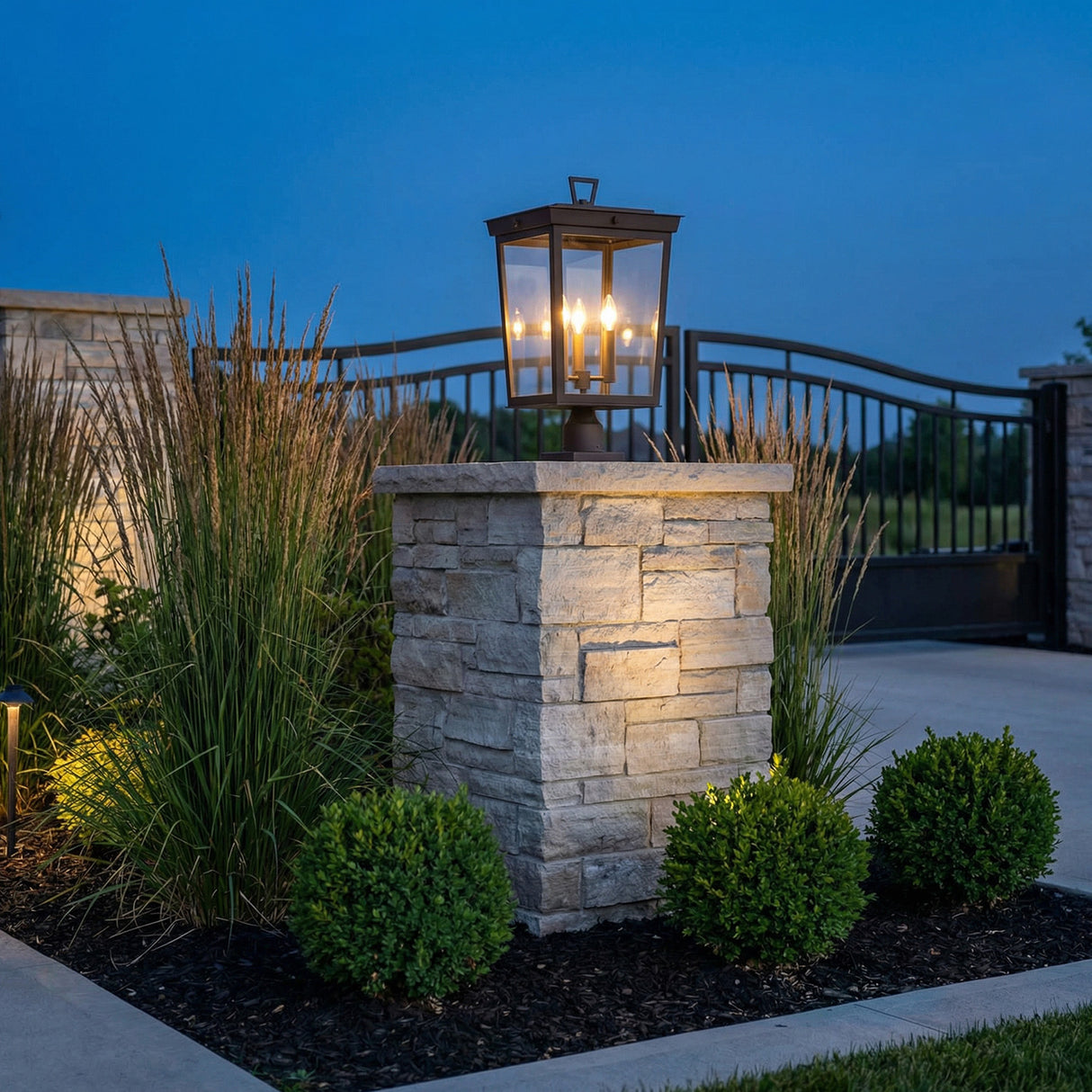 Radcliffe Outdoor Post Light, Old Bronze geometric Outdoor Post in a Craftsman Outdoor with a stone pillar and tall grasses.