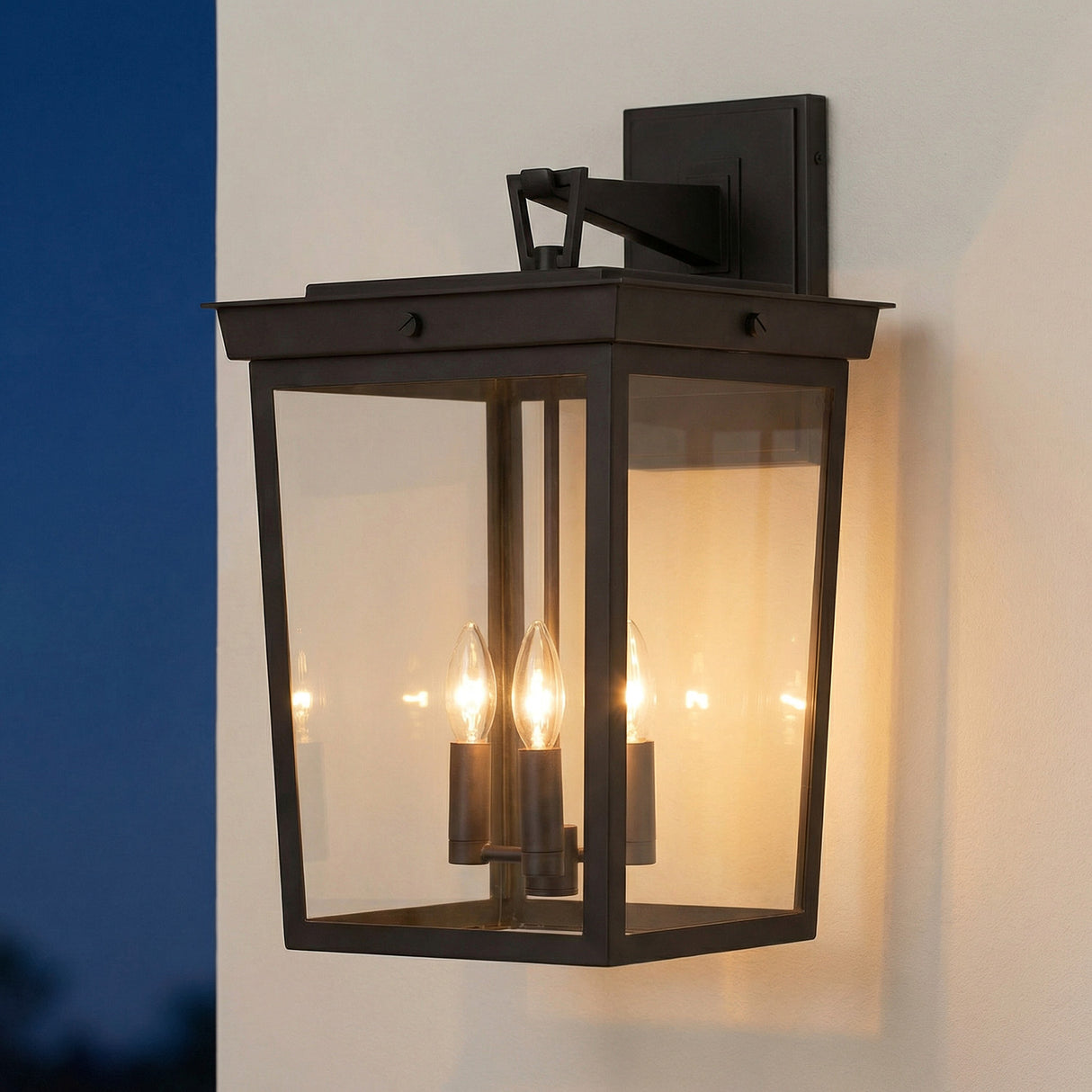 Radcliffe Old Bronze geometric Outdoor Wall Light in a Transitional Outdoor entryway with creamy stucco walls.