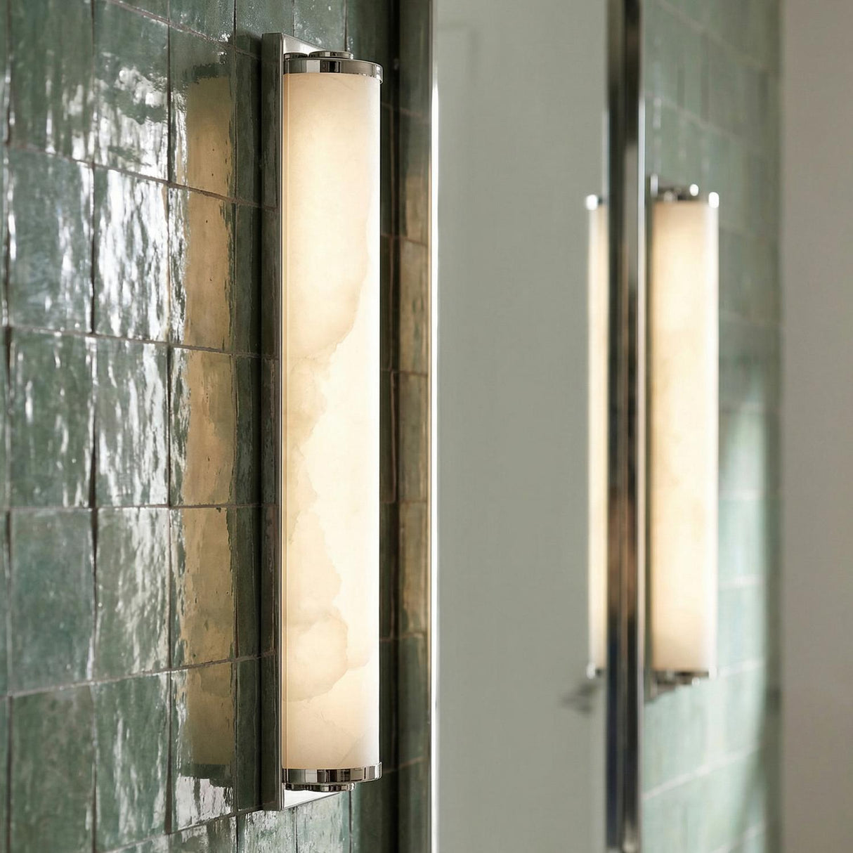 Abigail LED Wall Sconce, Polished Nickel linear Wall Sconce in a Contemporary Bathroom with a green tiled wall.