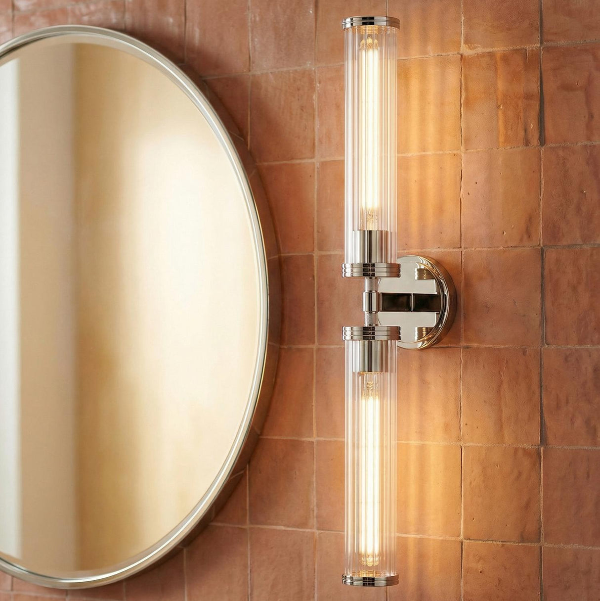 Dexter 2 Light Wall Sconce 29", Polished Nickel linear wall sconce in a Contemporary Bathroom with a round mirror and terracotta tiles.