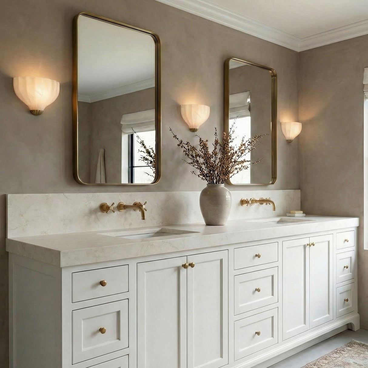 Claire Wall Sconce 9", Brass and Strie Glass scalloped wall sconce in a Transitional Bathroom with a double vanity and gold mirrors.