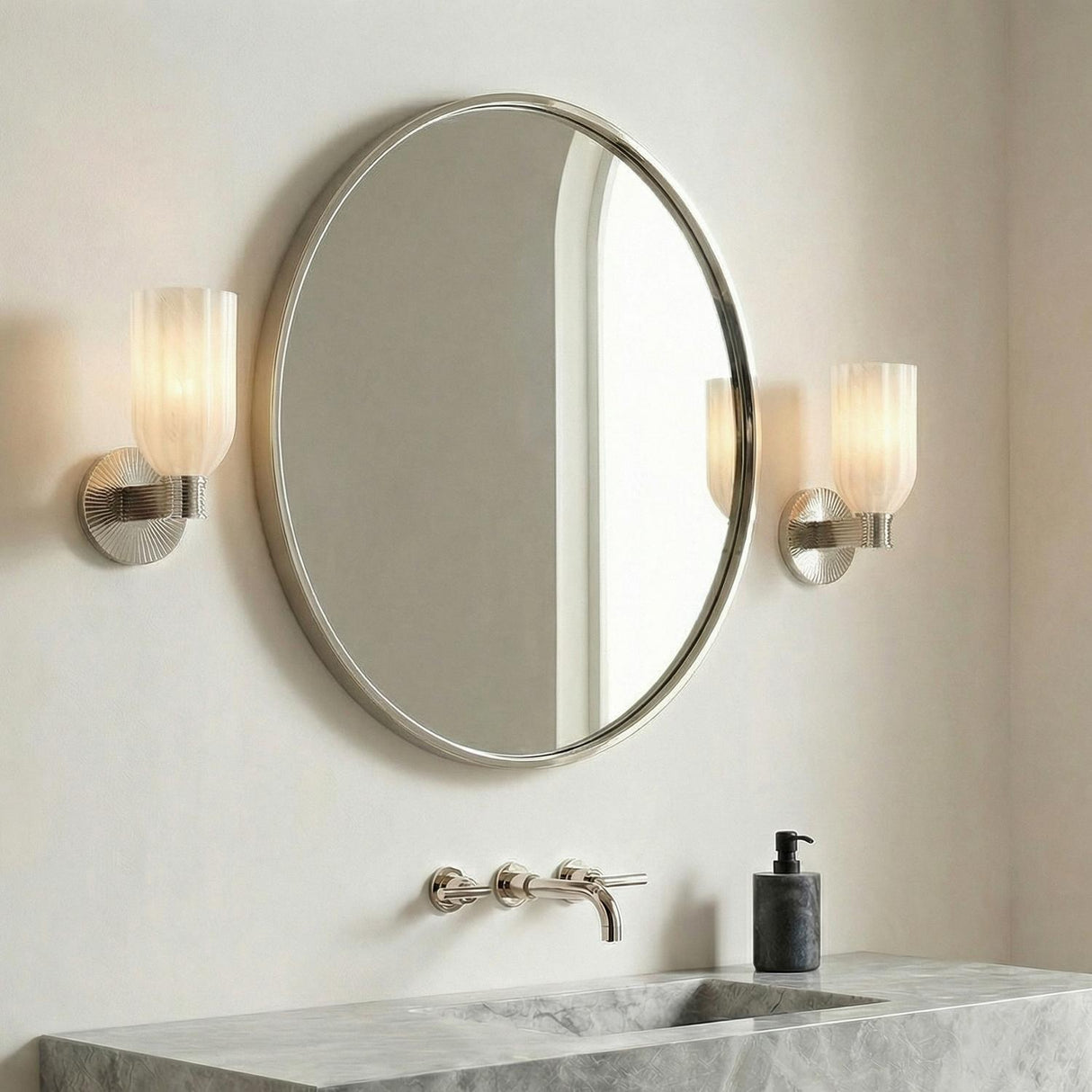 Elise Wall Sconce 11", Polished Nickel and Ribbed Strie Glass scalloped wall sconce in a Contemporary Bathroom with a round silver mirror.