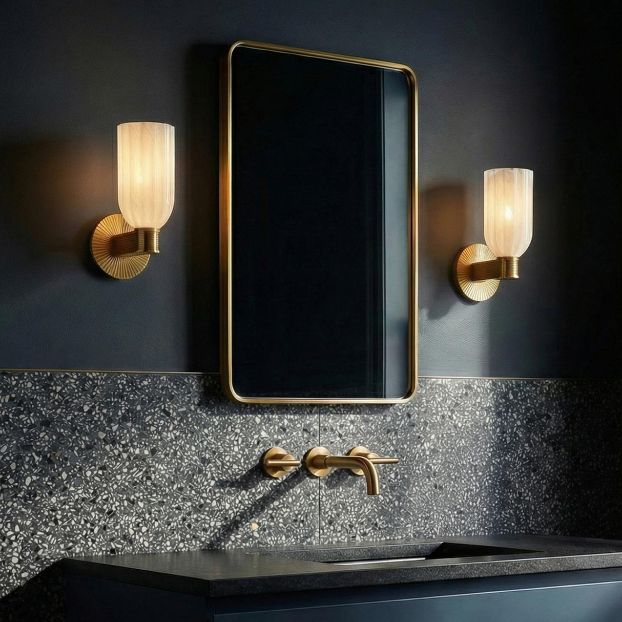 Elise Wall Sconce 11", Brass and Ribbed Strie Glass Brass scalloped Wall Sconce in a Contemporary Bathroom with terrazzo backsplash.