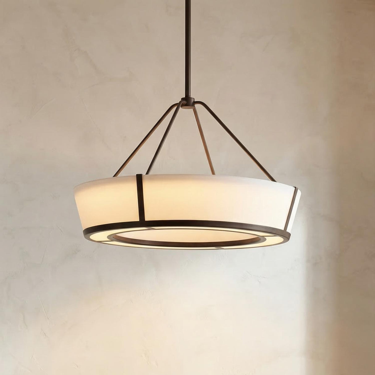 Hoyt LED Pendant 24", Bronze geometric Pendant in a Transitional Entryway with textured plaster walls.